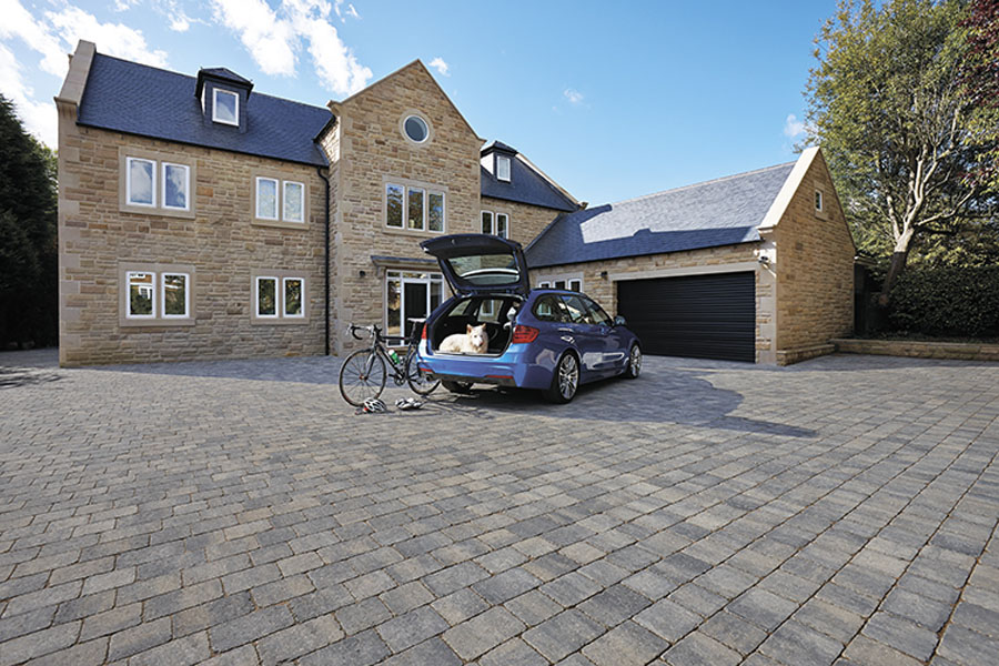 Block driveway in front of garage